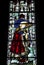 19th century stained glass window dedicated to saint aiden in the medieval cartmel priory in cumbria