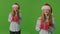 2-in-1 SplitGreen screenTeenage Girl In Santa Claus Hat And Holds A Bunch Of Gift Boxes In Her Hands