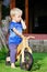 2 - 3 years joyful child riding a wooden balance bike