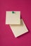 2 blank yellow adhesive notes on red