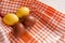 2 brown and 2 yellow Easter eggs on a towel in an orange cage, 4 boiled eggs