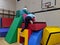 2 children climbing to the top of a soft play castle