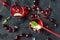 2 cups with cherry juice and fresh cherry on a dark background, top view