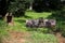 2 digger, excavator buckets sitting in a grassy area waiting to be used on the machine when needed