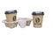 2 disposable cups with cup holder isolated on a white background. brown paper cups with the inscription coffee