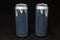 2 empty aluminium cans. Scratched and open, in black background