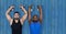 2 fitness man with the wights with blue wood background
