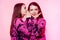 2 girls in the same things with bright makeup. Brunette girls, sisters, girlfriends, twins gossip, discuss, laugh. Women`s power,