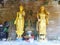 2 golden Buddha images with various offerings for Buddhists to worship,Thailand.