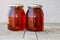 2 honey bottles wooden table