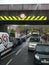 2 low bridges with hi Viz marker boards to prevent high vehicles colliding with the bridge in Wales, UK