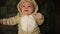 2 month old baby boy in cute costume lies on back and sneezes. Infant.