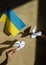 2 paper doves of peace and Ukrainian flag. Stand with Ukraine