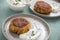 2 Plates with vegetarian oatmeal cottage cheese patty with herbal quark dip