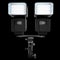 2 Speedlight flashes guns on tripod holder isolated on black