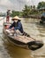 2 women on sloop along Kinh 28 canal in Cai Be, Mekong Delta, Vietnam