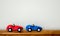 2 wooden toy race cars with copy space
