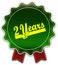 2 YEARS round green ribbon.