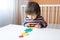 2 years toddler playing with geometric figures at home