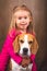 2 yeras old child hugging best friend dog. Happy childhood with pet Beagle