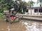 20 February 2021, Dirt Rust Trash Cart submerged in flood at condet East Jakarta, Indonesia while flooding