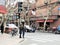 20 March 2019 - Ladies crossing the Street of Famous Former French Concession area in Shanghai, China. General store fruits shop