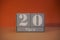 20 Marz on wooden grey cubes. Calendar cube date 20 March. Concept of date. Copy space for text. Educational cubes