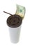 20 USD dollar banknote money leaving white paper cup for coffee