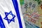 200, 100, 50 Sheqel banknotes and waving Israeli Flag. Israeli Shekels Banknotes, Israel Flag and Analytic Graphs