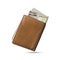 200 Namibian dollar notes popping out of a brown leather menâ€™s wallet. Namibian dollars in wallet