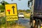 200 yards roadworks warning sign on UK motorway at evening with traffic passing