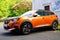 2008 Peugeot orange suv new model car parked in street