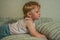 2010.06.12, Maloyaroslavets, Russia. A little boy lying on the sofa and watching TV.