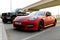 2013 custom red Porsche Panamera on a parking lot