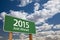 2015 Just Ahead Green Road Sign Over Clouds and Sky