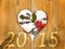 2015, wooden frame in the shape of a heart and branch of holly