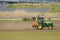 2017 March 19. Tokyo Japan. A worker man cleaning soil ground by tracktor car to preapre for agriculture