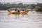 2017 Sept 17 Hippo Point, Kisumu, Lake Victoria, Kenya. Young African fishermen in old wooden fishing canoe, bring in the nets