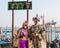 2017 Venice Carnival, Italy. Couple at lagoon with gondola sign