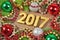 2017 year golden figures and spruce branch and Christmas decoration