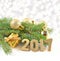 2017 year golden figures and spruce branch and Christmas decorations