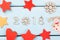 2018 Happy new Year. Christmas decorations red, yellow stars, angel, snowflake and heart on light blue wooden background. 2018 dec