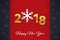 2018 Happy New Year golden 3D text on the Christmas red and dark background with snowflake silhouettes.