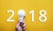 2018 Ideas creativity concept with human hand holding light bulb