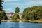 2019_07_24 London England Buckingham Palace and Victorias statue viewed across the lake in St James Park with willows dipping into