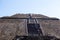 2019-11-25 Teotihuacan, Mexico. Tourists climb the steps of the moon pyramid, view from the bottom.