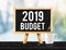 2019 budget on blackboard with easel on black marble table with