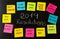 2019 Goals or New Year resolutions chalk handwriting and colorful post its memo notes on blackboard