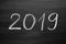 2019 Happy New Year, written with a chalk on the blackboard