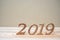 2019 Happy New years with brown wooden number on table and copy space. New Start, Resolution, Goals and Mission